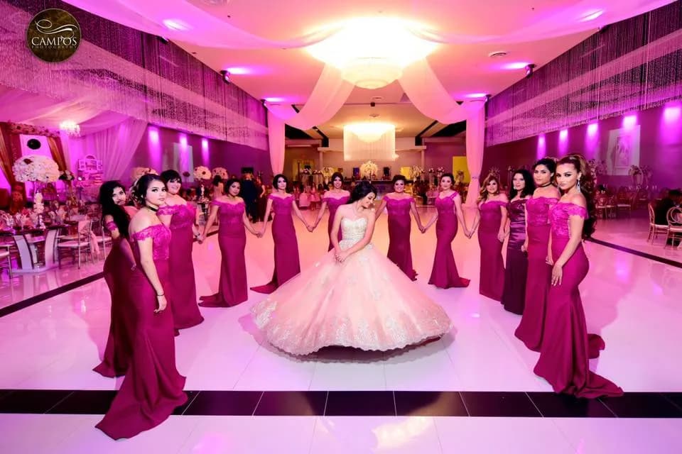 Quinceañera with a pink themed ballroom setup